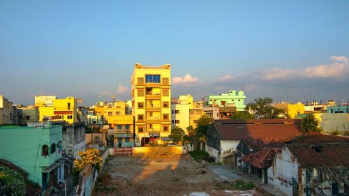 Houses against sky in city