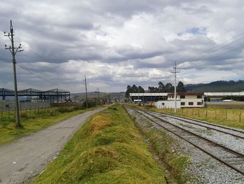 Railroad track on cloudy day