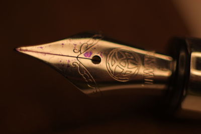 Close-up of pen on table