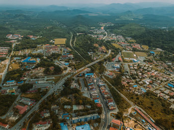 High angle view of street amidst buildings in city