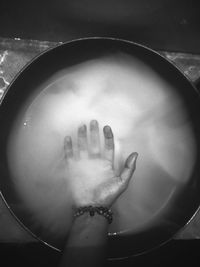 High angle view of hands in water