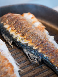 Close-up of meat on barbecue grill