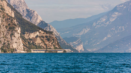 Scenic view of sea and mountains against sky