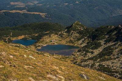 High angle view of lake amidst mountains