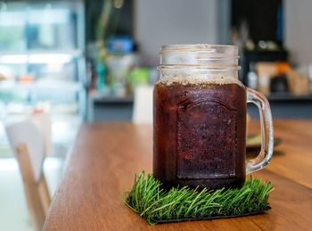 Close-up of drink in jar on table