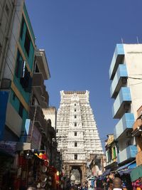 Low angle view of buildings against clear blue sky