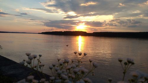 Scenic view of lake against sky during sunset