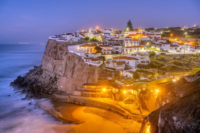 Azenhas do mar at the portuguese atlantic coast after sunset