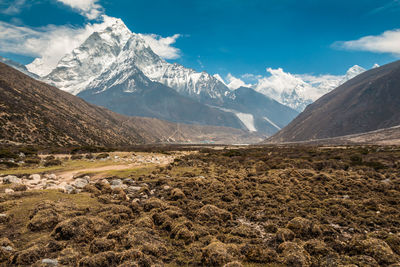 Scenic view of snowcapped mountains against sky