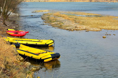 High angle view of yellow moored on beach