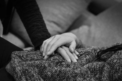 Close-up of couple holding hands