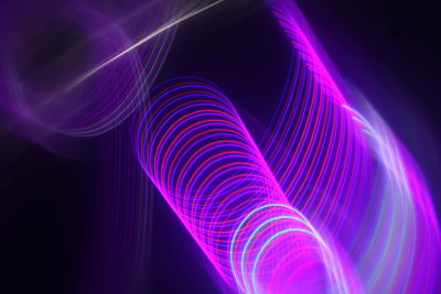 Full frame shot of light painting against black background