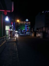 Illuminated street light at night