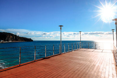 Gorgeous view from the pier or deck to the wide sea horizon on a sunny summer day