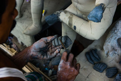 Man making statue in workshop