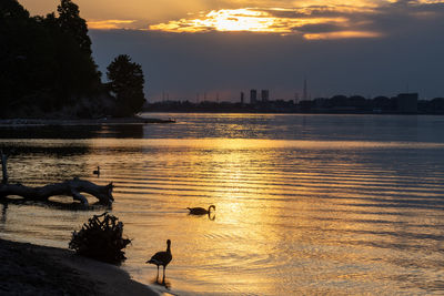 Scenic view of lake against sky during sunset