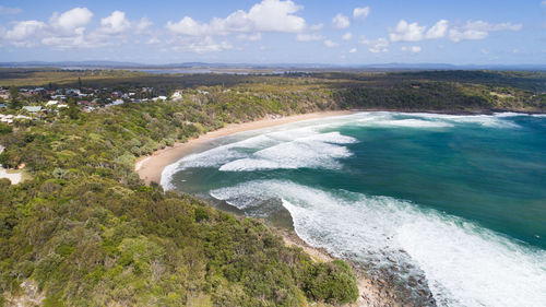 High angle view of sea shore against sky