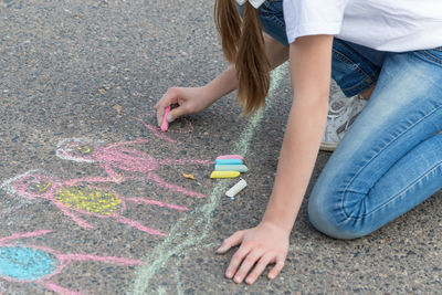 Low section of woman on street