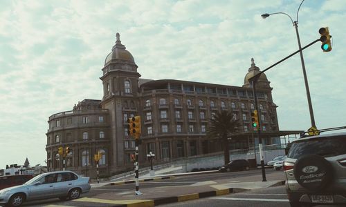 City street against cloudy sky