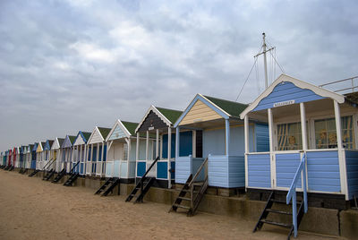 Beach huts against sky
