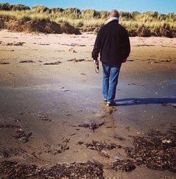 Full length of woman standing on beach