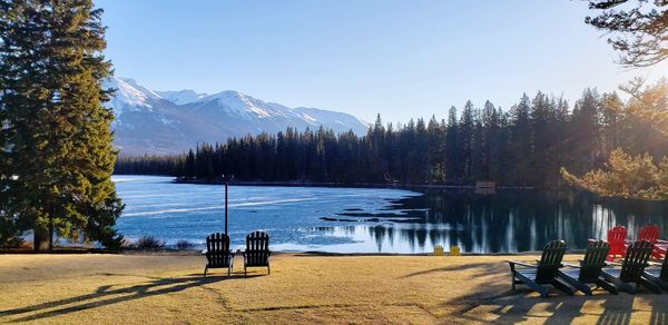 Scenic view of lake and mountains against sky