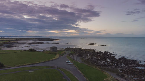 High angle view of road by sea against sky