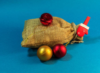 Close-up of tomatoes on table against blue background