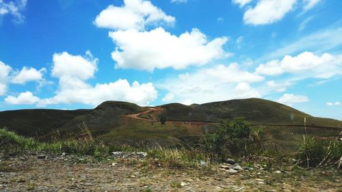 View of landscape against cloudy sky