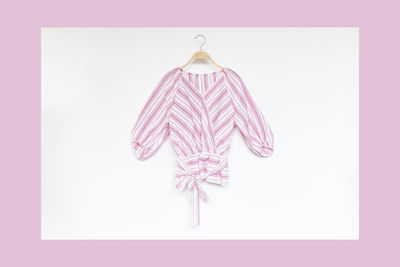 Directly above shot of pink hanging against white background