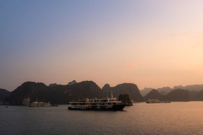 Scenic view of sea against clear sky during sunset