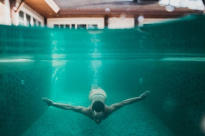 Woman swimming in pool