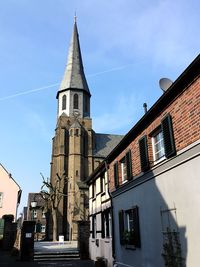 Low angle view of building against sky in city