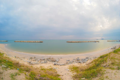 Scenic view of beach against sky