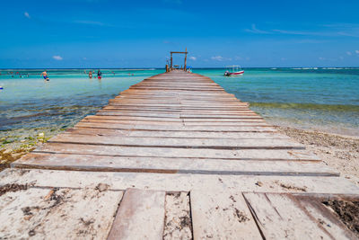 Pier over sea against sky