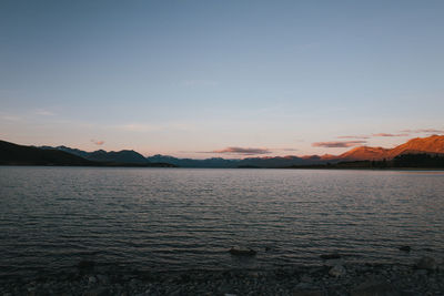 Scenic view of sea against clear sky during sunset