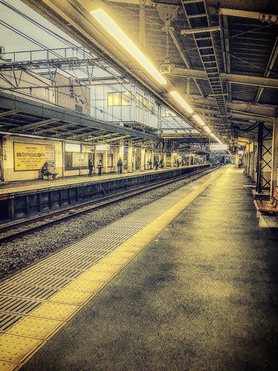 railroad track, rail transportation, transportation, architecture, railroad station, built structure, railroad station platform, public transportation, illuminated, the way forward, diminishing perspective, indoors, empty, vanishing point, no people, railway track, building exterior, train - vehicle, long, travel