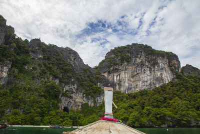 Scenic view of mountain against cloudy sky