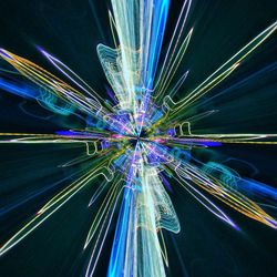 Low angle view of illuminated fireworks against sky at night