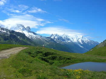 Scenic view of snowcapped mountains against sky