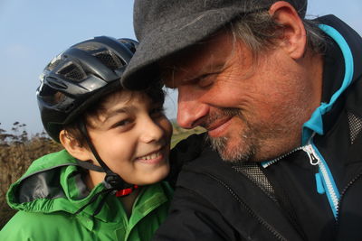 Portrait of smiling boy with grandfather