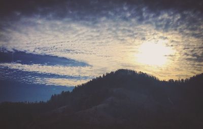 Scenic view of landscape against cloudy sky