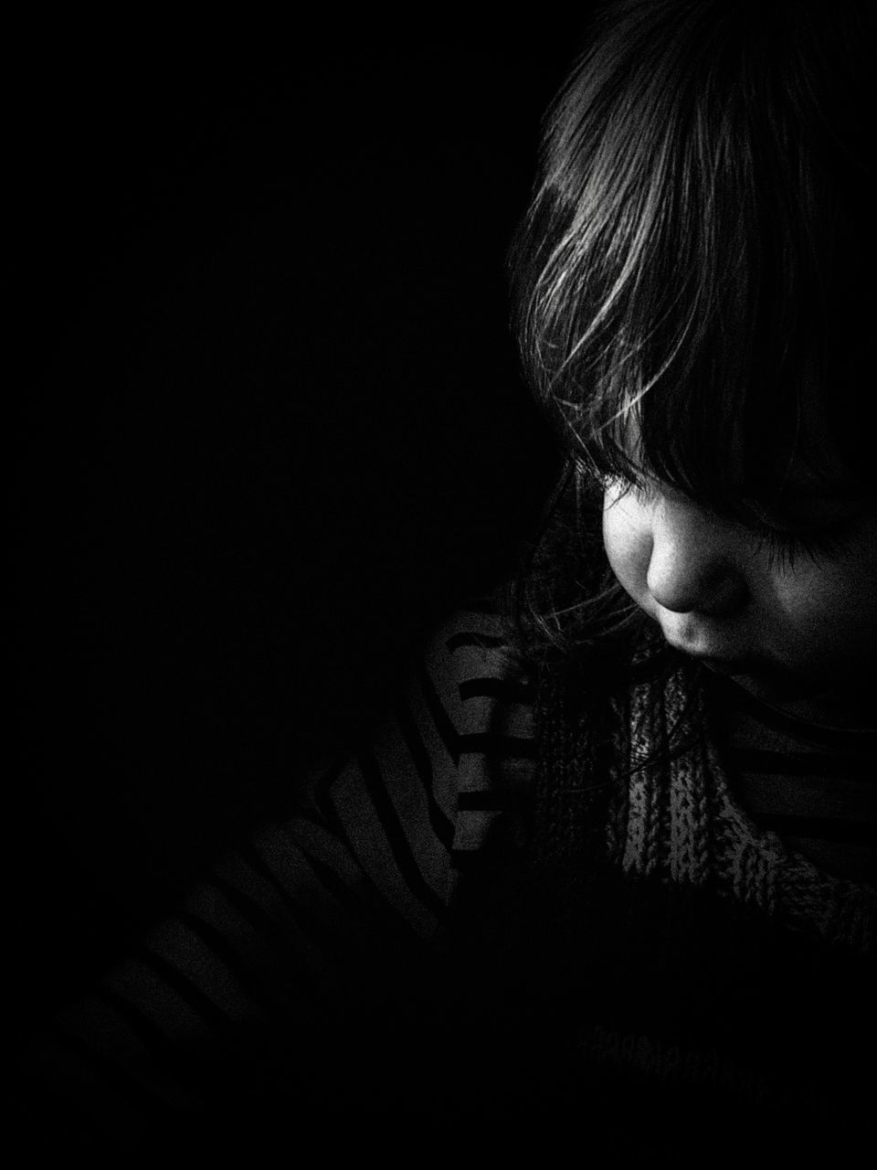 black, darkness, black and white, one person, white, indoors, monochrome photography, headshot, monochrome, portrait, black background, light, women, dark, studio shot, copy space, child, adult, childhood, sadness, close-up, looking, human face, emotion, lifestyles, female, person, depression - sadness, human eye, contemplation