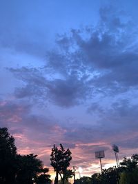 Low angle view of silhouette trees against sky during sunset