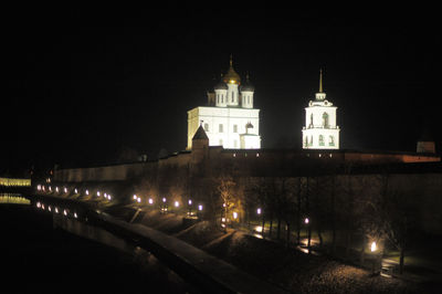 Illuminated building against sky at night