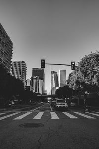 City street and buildings against clear sky