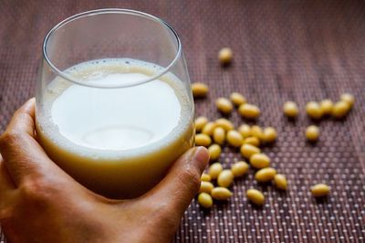 Close-up of hand holding drink