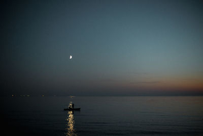 Scenic view of sea against sky at night