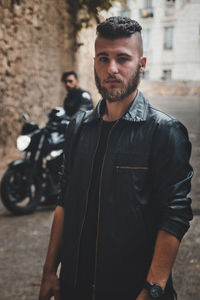 Portrait of young men on road