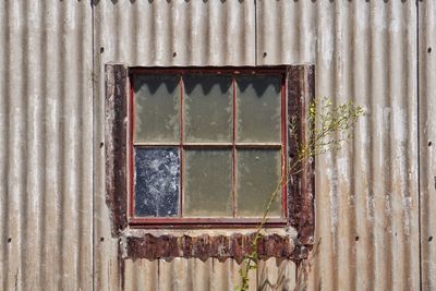 Close-up of old window of building